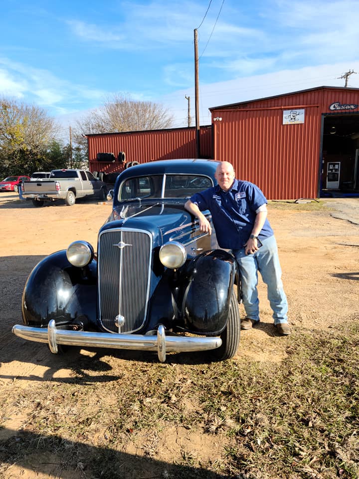 welding and fitment in the service bay on the lift at JR Discount Muffler in Palestine, Texas